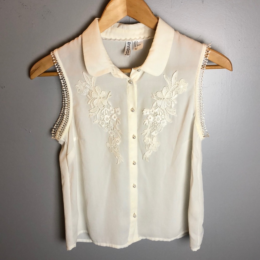 White sleeveless button up